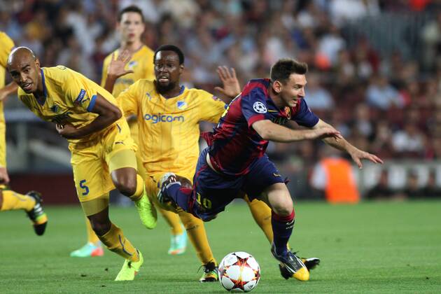 17.09.2014. Barcelona, Spain. Champions league Group F. Barcelona versus Apoel. Messi gets barged over by the defender during the match xAngelxBoludax  ActionPlus19090425