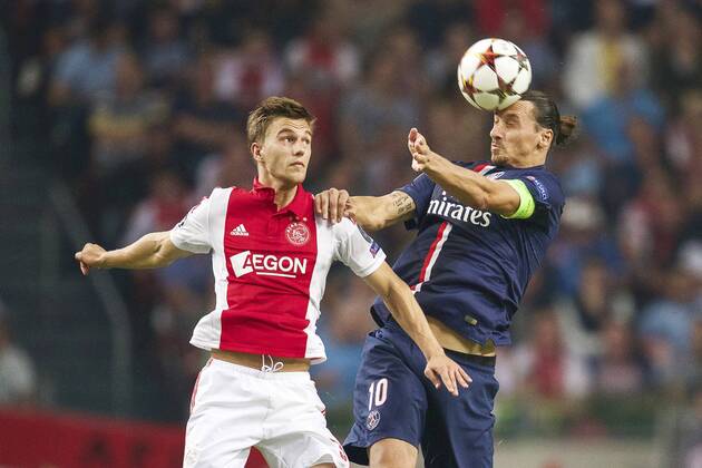 (L-R) Joel Veltman of Ajax, Zlatan Ibrahimovic of Paris Saint-Germain during the UEFA Champions League group F match between Ajax Amsterdam and Paris Saint-Germain on September 17, 2014 at the Amsterdam Arena in Amsterdam, The Netherlands. Ajax Amsterdam v PSG UEFA Champions League Group F 2014 2015 xVIxxIVx 2655415