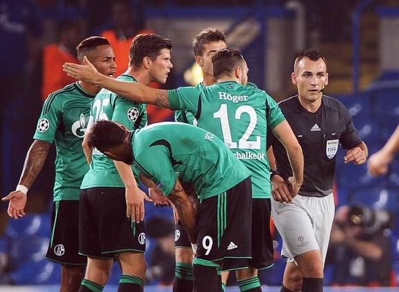 Football - 2014 2015 Champions League - Group G: Chelsea vs. FC Schalke 04 Schalke s players complain to the Referee, Ivan Bebek after Chelsea s goal after Meyer was fouled at Stamford Bridge. COLORSPORT ANDREW COWIE 