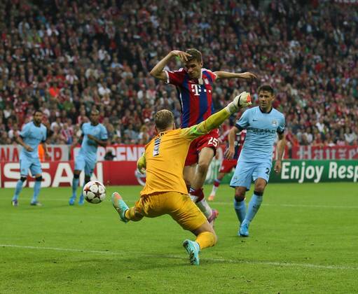Bayern Munich s Thomas Muller sees his shot saved by Manchester City s Joe Hart - Champions League Group E - Bayern Munich vs Manchester City - Allianz Arena - Germany - 17th September 2014 - Picture David Klein Sportimage EDITORIAL USE ONLY. No use with unauthorised audio, video, data, fixture lists, club league logos or live services. Online in-match use limited to 120 images, no video emulation. No use in betting, games or single club league player publications.