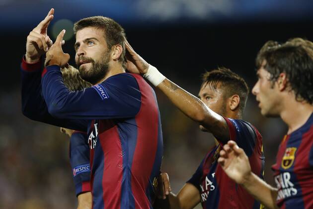 BARCELONA, Sept. 17, 2014 -- Barcelona s Gerard Pique (L) celebrates a goal with teammates during the group match of UEFA Champions League against Apoel FC, at the Camp Nou stadium in Barcelona on September 17, 2014. Barcelona won 1-0. ) (SP)SPAIN-BARCELONA-FOOTBALL-UEFA CHAMPIONS LEAGUE PauxBarrena 