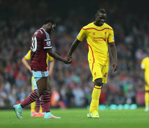 Despite being 2-0 down Liverpool s Mario Balotelli finds time to have a joke with West Ham s Alex Song - Barclays Premier League - West Ham United vs Liverpool - Upton Park - England - 20th September 2014 - Picture David Klein Sportimage EDITORIAL USE ONLY. No use with unauthorised audio, video, data, fixture lists, club league logos or live services. Online in-match use limited to 120 images, no video emulation. No use in betting, games or single club league player publications.