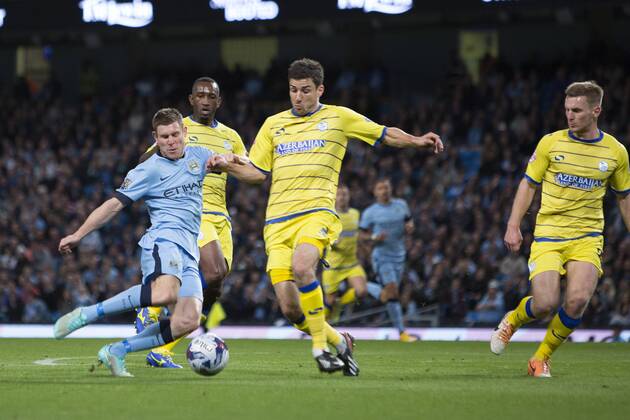 Wednesday s Lewis Buxton puts in a last second challenge on James Milner of Manchester City - Manchester City vs. Sheffield Wednesday - Capital One League Cup - Anfield - Liverpool - 24 09 2014 EDITORIAL USE ONLY. No use with unauthorised audio, video, data, fixture lists, club league logos or live services. Online in-match use limited to 120 images, no video emulation. No use in betting, games or single club league player publications.