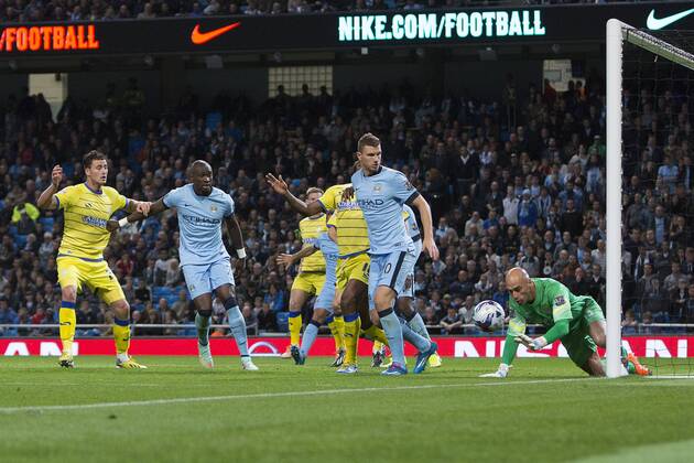 Willy Caballero of Manchester City fumbles a strike from Wednesday s Giles Coke - Manchester City vs. Sheffield Wednesday - Capital One League Cup - Anfield - Liverpool - 24 09 2014 EDITORIAL USE ONLY. No use with unauthorised audio, video, data, fixture lists, club league logos or live services. Online in-match use limited to 120 images, no video emulation. No use in betting, games or single club league player publications.