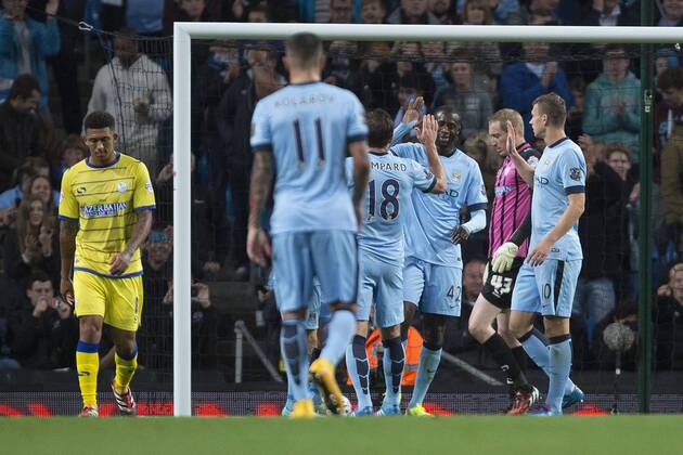 Yaya Toure of Manchester City celebrates scoring his sides fourth goal - Manchester City vs. Sheffield Wednesday - Capital One League Cup - Anfield - Liverpool - 24 09 2014 EDITORIAL USE ONLY. No use with unauthorised audio, video, data, fixture lists, club league logos or live services. Online in-match use limited to 120 images, no video emulation. No use in betting, games or single club league player publications.