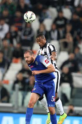 Sept. 24, 2014 - Turin, Italy - Juventus defender Patrice Evra (33) and Cesena midfielder Luigi Giorgi (5) reaches for the ballduring the Italian Serie A football match Juventus Vs Cesena on September 24, 2014 at Juventus Stadium in Turin. Soccer, Serie A: Juventus v Cesena - ZUMAn230