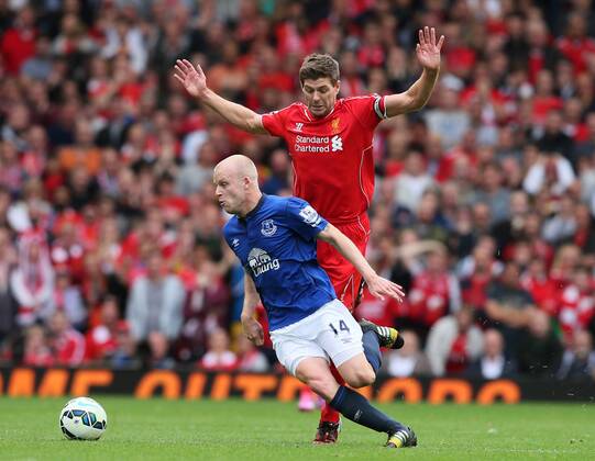 Steven Naismith of Everton cuts across Steven Gerrard of Liverpool - Barclays Premier League - Liverpool vs Everton - Anfield Stadium - Liverpool - England - 27th September 2014 - Picture Simon Bellis Sportimage EDITORIAL USE ONLY. No use with unauthorised audio, video, data, fixture lists, club league logos or live services. Online in-match use limited to 120 images, no video emulation. No use in betting, games or single club league player publications.