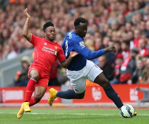 Raheem Sterling of Liverpool tussles with Romelu Lukaku of Everton l- Barclays Premier League - Liverpool vs Everton - Anfield Stadium - Liverpool - England - 27th September 2014 - Picture Simon Bellis Sportimage EDITORIAL USE ONLY. No use with unauthorised audio, video, data, fixture lists, club league logos or live services. Online in-match use limited to 120 images, no video emulation. No use in betting, games or single club league player publications.