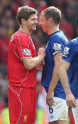 The two goalscorers Steven Gerrard of Liverpool and Phil Jagielka of Everton smile at the end of the match - Barclays Premier League - Liverpool vs Everton - Anfield Stadium - Liverpool - England - 27th September 2014 - EDITORIAL USE ONLY. No use with unauthorised audio, video, data, fixture lists, club league logos or live services. Online in-match use limited to 120 images, no video emulation. No use in betting, games or single club league player publications.