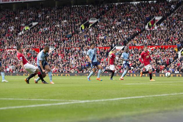 Robin van Persie of Manchester United scores his sides second goal - Manchester United vs. West Ham United - Barclay s Premier League - Old Trafford - Manchester - 27 09 2014 Pic Philip Oldham Sportimage EDITORIAL USE ONLY. No use with unauthorised audio, video, data, fixture lists, club league logos or live services. Online in-match use limited to 120 images, no video emulation. No use in betting, games or single club league player publications.