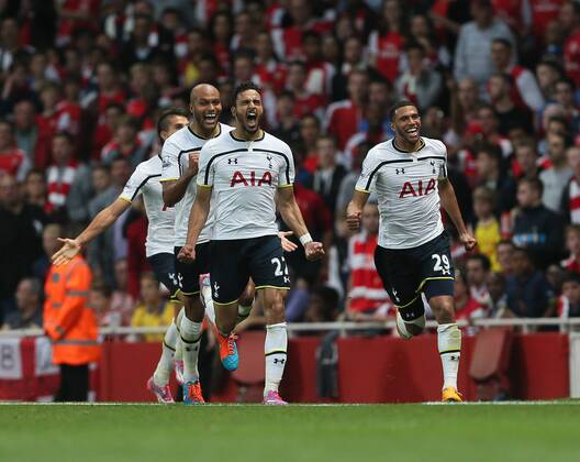 Tottenham s Nacer Chadli celebrates scoring his sides opening goal - Barclays Premier League - Arsenal vs Tottenham Hotspur - Emirates Stadium - England - 27th September 2014 - EDITORIAL USE ONLY. No use with unauthorised audio, video, data, fixture lists, club league logos or live services. Online in-match use limited to 120 images, no video emulation. No use in betting, games or single club league player publications.