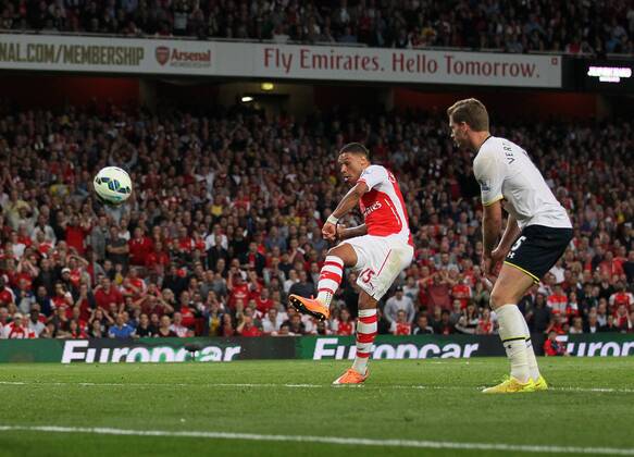 Arsenal s Alex Oxlade-Chamberlain scoring his sides opening goal - Barclays Premier League - Arsenal vs Tottenham Hotspur - Emirates Stadium - England - 27th September 2014 - EDITORIAL USE ONLY. No use with unauthorised audio, video, data, fixture lists, club league logos or live services. Online in-match use limited to 120 images, no video emulation. No use in betting, games or single club league player publications.