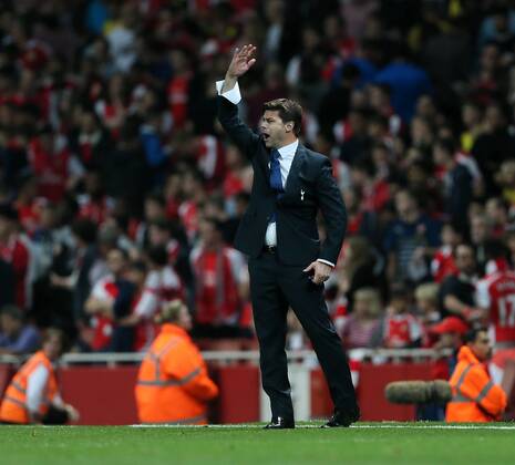 Tottenham s Mauricio Pochettino in action - Barclays Premier League - Arsenal vs Tottenham Hotspur - Emirates Stadium - England - 27th September 2014 - EDITORIAL USE ONLY. No use with unauthorised audio, video, data, fixture lists, club league logos or live services. Online in-match use limited to 120 images, no video emulation. No use in betting, games or single club league player publications.