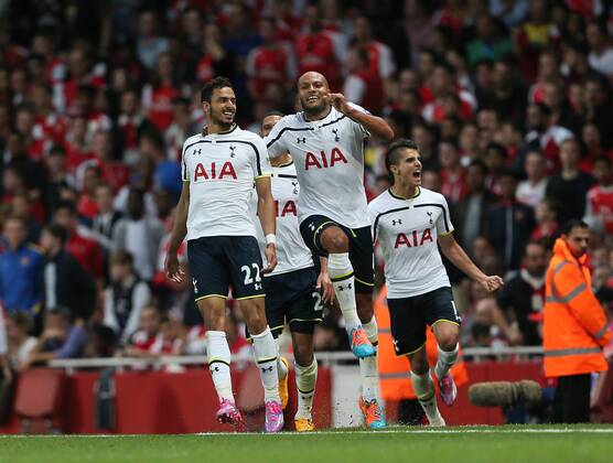 Tottenham s Nacer Chadli celebrates scoring his sides opening goal - Barclays Premier League - Arsenal vs Tottenham Hotspur - Emirates Stadium - England - 27th September 2014 - EDITORIAL USE ONLY. No use with unauthorised audio, video, data, fixture lists, club league logos or live services. Online in-match use limited to 120 images, no video emulation. No use in betting, games or single club league player publications.