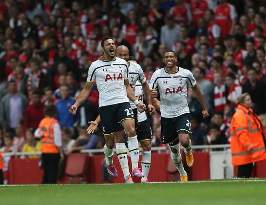 Tottenham s Nacer Chadli celebrates scoring his sides opening goal - Barclays Premier League - Arsenal vs Tottenham Hotspur - Emirates Stadium - England - 27th September 2014 - EDITORIAL USE ONLY. No use with unauthorised audio, video, data, fixture lists, club league logos or live services. Online in-match use limited to 120 images, no video emulation. No use in betting, games or single club league player publications.
