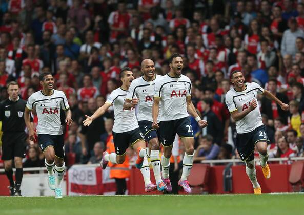 Tottenham s Nacer Chadli celebrates scoring his sides opening goal - Barclays Premier League - Arsenal vs Tottenham Hotspur - Emirates Stadium - England - 27th September 2014 - EDITORIAL USE ONLY. No use with unauthorised audio, video, data, fixture lists, club league logos or live services. Online in-match use limited to 120 images, no video emulation. No use in betting, games or single club league player publications.