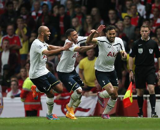 Tottenham s Nacer Chadli celebrates scoring his sides opening goal - Barclays Premier League - Arsenal vs Tottenham Hotspur - Emirates Stadium - England - 27th September 2014 - EDITORIAL USE ONLY. No use with unauthorised audio, video, data, fixture lists, club league logos or live services. Online in-match use limited to 120 images, no video emulation. No use in betting, games or single club league player publications.