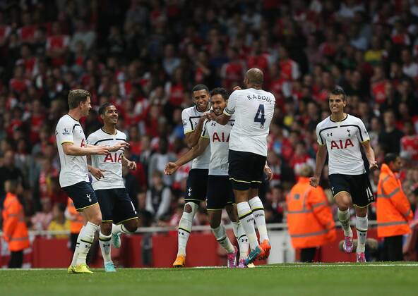 Tottenham s Nacer Chadli celebrates scoring his sides opening goal - Barclays Premier League - Arsenal vs Tottenham Hotspur - Emirates Stadium - England - 27th September 2014 - EDITORIAL USE ONLY. No use with unauthorised audio, video, data, fixture lists, club league logos or live services. Online in-match use limited to 120 images, no video emulation. No use in betting, games or single club league player publications.