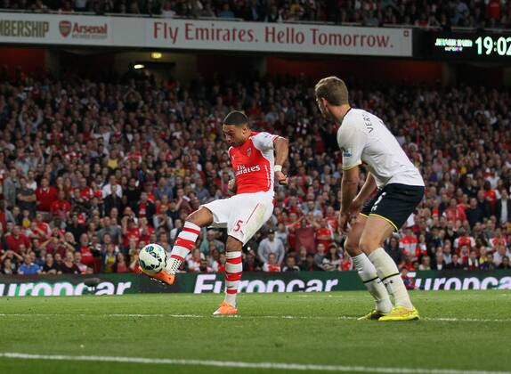 Arsenal s Alex Oxlade-Chamberlain scoring his sides opening goal - Barclays Premier League - Arsenal vs Tottenham Hotspur - Emirates Stadium - England - 27th September 2014 - EDITORIAL USE ONLY. No use with unauthorised audio, video, data, fixture lists, club league logos or live services. Online in-match use limited to 120 images, no video emulation. No use in betting, games or single club league player publications.