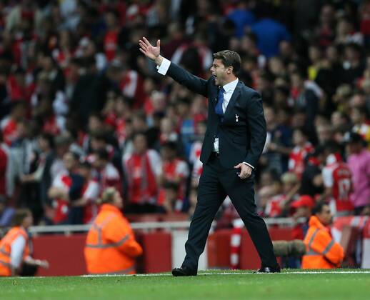 Tottenham s Mauricio Pochettino in action - Barclays Premier League - Arsenal vs Tottenham Hotspur - Emirates Stadium - England - 27th September 2014 - EDITORIAL USE ONLY. No use with unauthorised audio, video, data, fixture lists, club league logos or live services. Online in-match use limited to 120 images, no video emulation. No use in betting, games or single club league player publications.