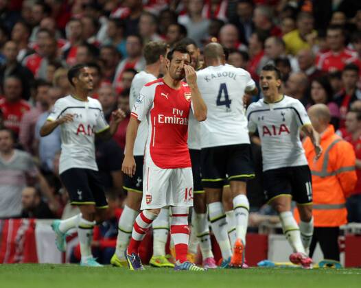 Arsenal FC London - Tottenham Hotspur Nacer Chadli (TH) celebrates scoring a goal for Tottenham as Santi Cazorla (A) is dejected. 0-1