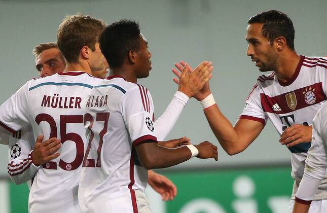 ITAR-TASS: MOSCOW REGION, RUSSIA. SEPTEMBER 30, 2014. Bayern Munich s Philipp Lahm, Thomas Mueller, David Alaba, and Mehdi Benatia (L-R) celebrate scoring in their 2014 15 Season UEFA Champions League Group E football match against CSKA Moscow at Arena Khimki Stadium.  RE1509D8