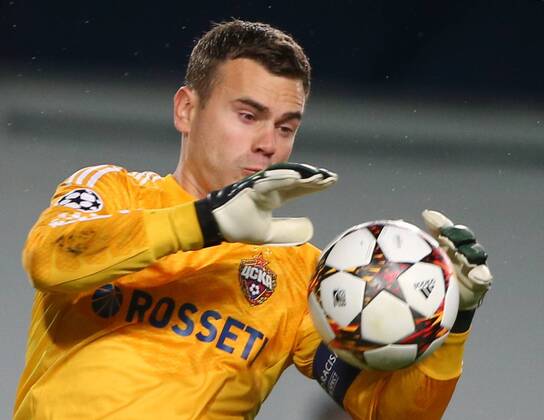 ITAR-TASS: MOSCOW REGION, RUSSIA. SEPTEMBER 30, 2014. CSKA s goalkeeper Igor Akinfeev makes a save in a 2014 15 Season UEFA Champions League Group E football match against Bayern Munich at Arena Khimki Stadium. The game is played behind closed doors as CSKA have been punished for their fans poor behaviour in a Champions League match against Viktoria Plzen last year.  RE1509DA
