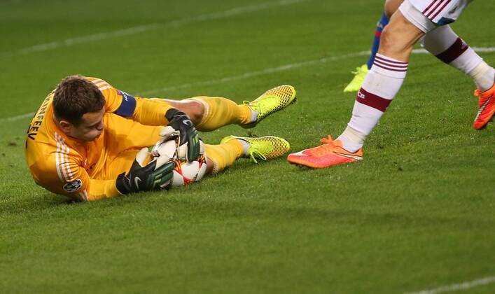 ITAR-TASS: MOSCOW REGION, RUSSIA. SEPTEMBER 30, 2014. CSKA s goalkeeper Igor Akinfeev makes a save in a 2014 15 Season UEFA Champions League Group E football match against Bayern Munich at Arena Khimki Stadium. The game is played behind closed doors as CSKA have been punished for their fans poor behaviour in a Champions League match against Viktoria Plzen last year.  RE1509DB
