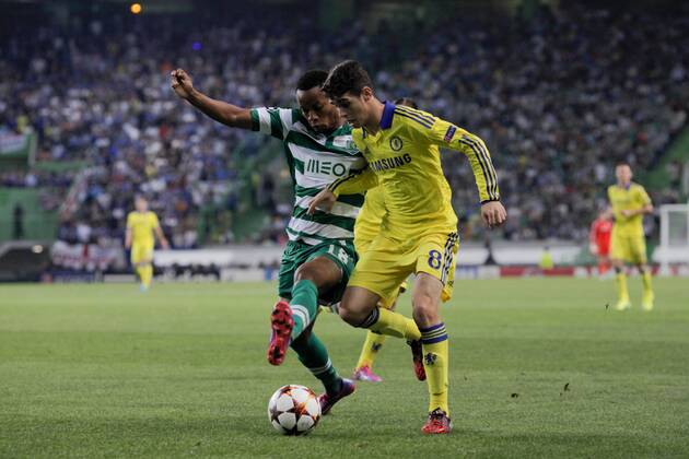 Sporting s forward Andre Carrilho (L) vies with Chelsea s midfielder, Oscar (R) during a soccer match between Portugal s Sporting CP and England s Chelsea FC for the group stage of the UEFA Champions League, in Sporting s Alvalade Stadium in Lisbon, Portugal, on September 30, 2014. Photo by Pedro Nunes Portugal: UEFA Champions League: Sporting Vs Chelsea 