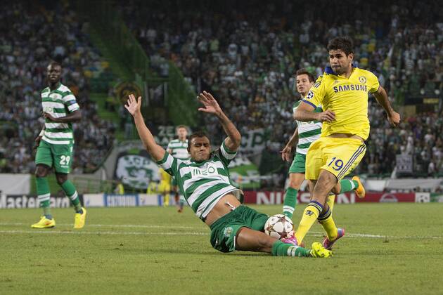 Sporting s Mauricio challenges Diego Costa of Chelsea - Sporting Lisbon vs. Chelsea - UEFA Champions League - Estadio Jose Alvalade - Lisbon - 30 09 2014 Pic Philip Oldham Sportimage EDITORIAL USE ONLY. No use with unauthorised audio, video, data, fixture lists, club league logos or live services. Online in-match use limited to 120 images, no video emulation. No use in betting, games or single club league player publications.