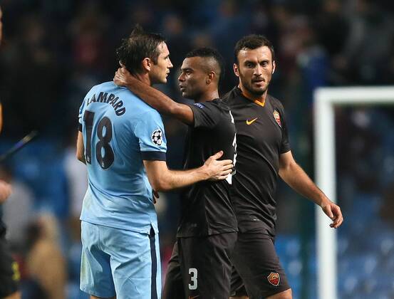 Frank Lampard of Manchester City and Ashley Cole of Roma hug at the end of the game - UEFA Champions League group E - Manchester City vs Roma - Etihad Stadium - Manchester - England - 30th September 2014 - Picture Simon Bellis Sportimage EDITORIAL USE ONLY. No use with unauthorised audio, video, data, fixture lists, club league logos or live services. Online in-match use limited to 120 images, no video emulation. No use in betting, games or single club league player publications.