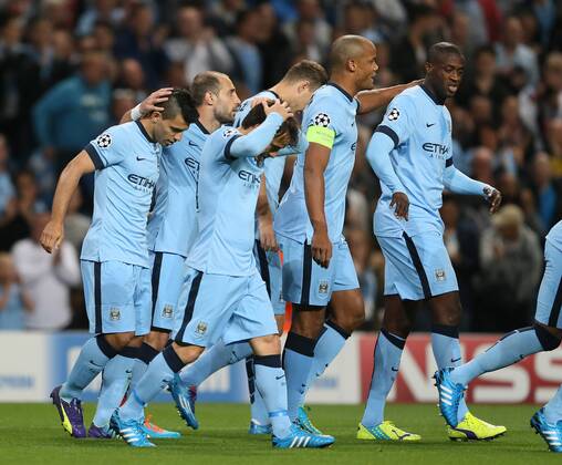 Sergio Aguero of Manchester City (l) celebrates his goal - UEFA Champions League group E - Manchester City vs Roma - Etihad Stadium - Manchester - England - 30th September 2014 - Picture Simon Bellis Sportimage EDITORIAL USE ONLY. No use with unauthorised audio, video, data, fixture lists, club league logos or live services. Online in-match use limited to 120 images, no video emulation. No use in betting, games or single club league player publications.