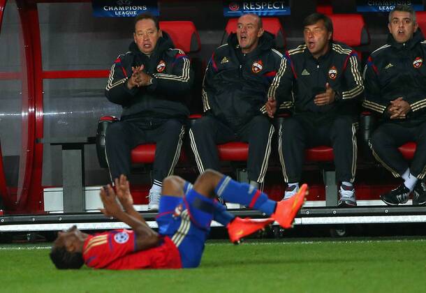 MOSCOW REGION, RUSSIA. SEPTEMBER 30, 2014. CSKA s Ahmed Musa (front) and head coach Leonid Slutsky (L background) seen in their 2014 15 Season UEFA Champions League Group E football match against Bayern Munich at Arena Khimki Stadium. The game is played behind closed doors as CSKA have been punished for their fans poor behaviour in a Champions League match against Viktoria Plzen last year. FC Bayern won the game 1:0. Valery Sharifulin TASS  RE150A0D