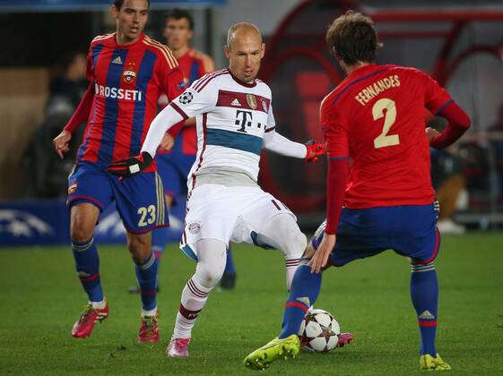 MOSCOW REGION, RUSSIA. SEPTEMBER 30, 2014. CSKA s Georgi Milanov (L),Mario Fernandes (R) and Bayern s Arjen Robben (C) fight for the ball their 2014 15 Season UEFA Champions League Group E football match at Arena Khimki Stadium. The game is played behind closed doors as CSKA have been punished for their fans poor behaviour in a Champions League match against Viktoria Plzen last year. FC Bayern won the game 1:0. Valery Sharifulin TASS  RE150A0E