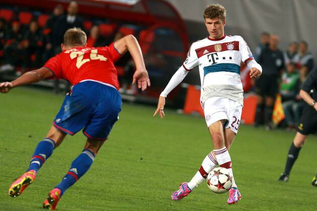 September 30, 2014. Russia, Khimki, arena New Khimki. CSKA s player Vasili Berezutski and Bayern s player Tomas Muller in the 2014 15 UEFA Champions League s group stage match between CSKA (Moscow, Russia) and FC Bayern Munich (Munich, Germany) DmitryxGolubovich 