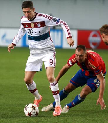 CSKA s player Sergei Ignashevich and Bayern s player Robert Lewandowski in the 2014 15 UEFA Champions League s group stage match between CSKA (Moscow, Russia) and FC Bayern Munich (Munich, Germany) DmitryxGolubovich 