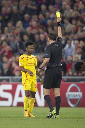 Raheem Sterling of Liverpool receives a yellow card - FC Basel vs. Liverpool - UEFA Champions League - St Jakobs Park - Basel - 01 10 2014 Pic Philip Oldham Sportimage EDITORIAL USE ONLY. No use with unauthorised audio, video, data, fixture lists, club league logos or live services. Online in-match use limited to 120 images, no video emulation. No use in betting, games or single club league player publications.