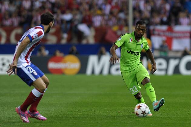 Juventus Defender, Patrice Evra - EVRA, number 33 . Atletico de Madrid Defender, Juan Francisco Torres Belen - JUANFRAN, number 20. Atletico Madrid - Juventus Turin. 
