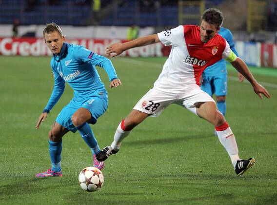 ST PETERSBURG, RUSSIA. OCTOBER 1, 2014. Zenit s Domenico Criscito (L) and Monaco s Geoffrey Kondogbia in action in their UEFA Champions League Round 2 Group C football match at Petrovsky Stadium. The game ended in a 0-0 draw. Ruslan Shamukov TASS  RE150B8F