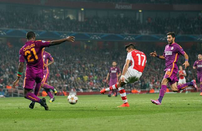 Arsenal s Alexis Sanchez scoring his sides third goal - UEFA Champions League Group D - Arsenal vs Galatasaray - Emirates Stadium - England - 01st October 2014 - Picture David Klein Sportimage EDITORIAL USE ONLY. No use with unauthorised audio, video, data, fixture lists, club league logos or live services. Online in-match use limited to 120 images, no video emulation. No use in betting, games or single club league player publications.