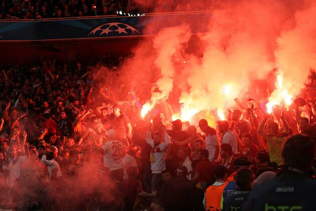 Galatasaray Istanbul fans throw flares onto the pitch after going 2-0 - UEFA Champions League Group D - Galatasaray Istanbul - Emirates Stadium - England - 01st October 2014 - EDITORIAL USE ONLY. No use with unauthorised audio, video, data, fixture lists, club league logos or live services. Online in-match use limited to 120 images, no video emulation. No use in betting, games or single club league player publications.