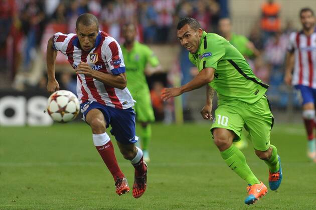 Juventus Forward, Carlos Tevez - TEVEZ, number 10 . Atletico de Madrid Defender, Joao Miranda de Souza Filho - MIRANDA, number 23. Atletico de Madrid - Juventus Turin. 