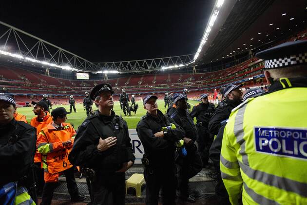01.10.2014. London, England. Champions League Group Stage. Riot police with dogs having to guard the away end of Galatasaray Istanbul fans xCraigxMercerx  ActionPlus20229526
