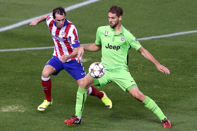 Atletico de Madrid s Diego Godin (l) and Juventus Fernando LLorente during Champions League 2014 2015 match.October 1,2014.  (20229578)