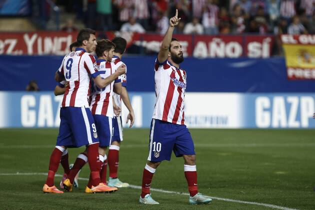 Atletico de Madrid s players celebrate Arda Turan s goal during Champions League soccer match between Atletico de Madrid and Juventus at Vicente Calderon stadium in Madrid, Spain. October 01, 2014.  (20229593)