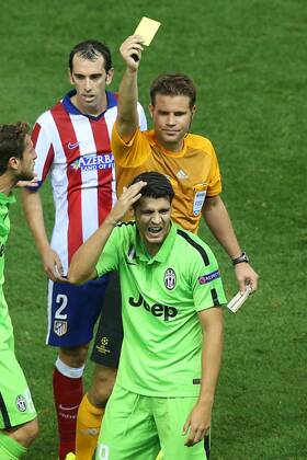 Referee Felix Brych show yellow card to Juventus Alvaro Morata during Champions League 2014 2015 match.October 1,2014.  (20229598)
