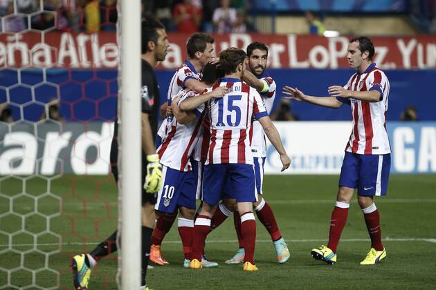 Atletico de Madrid s players celebrate Arda Turan s goal during Champions League soccer match between Atletico de Madrid and Juventus at Vicente Calderon stadium in Madrid, Spain. October 01, 2014.  (20229602)