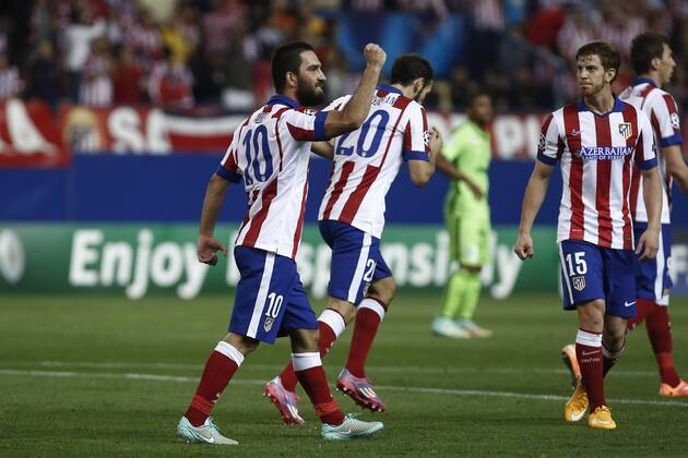 Atletico de Madrid s players celebrate Arda Turan s goal during Champions League soccer match between Atletico de Madrid and Juventus at Vicente Calderon stadium in Madrid, Spain. October 01, 2014.  (20229603)