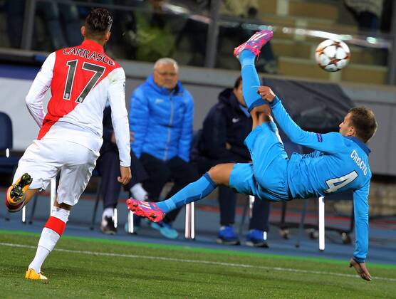 ST PETERSBURG, RUSSIA. OCTOBER 1, 2014. Monacoâ€™s Yannick Ferreira Carrasco and Zenitâ€™s Domenico Criscito (R) in action in their UEFA Champions League Round 2 Group C football match at Petrovsky Stadium. The game ended in a 0-0 draw. RuslanxShamukov TASS  RE150BBF