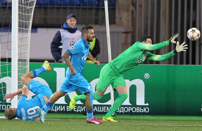 ST PETERSBURG, RUSSIA. OCTOBER 1, 2014. Zenitâ€™s Igor Smolnikov, Daniel Danny Miguel and Monacoâ€™s goalie Danijel Subasic (L to R) fight for the ball in their UEFA Champions League Round 2 Group C football match with Monaco at Petrovsky Stadium. The game ended in a 0-0 draw. RuslanxShamukov TASS  RE150BC0